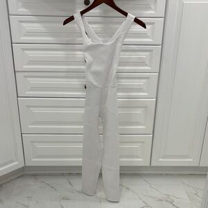 Heros Active White Cross-Back Onesie Jumpsuit in white. Extra small.